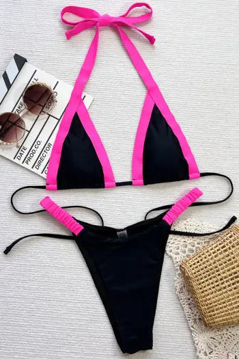 black bikini set on beach with sunhat