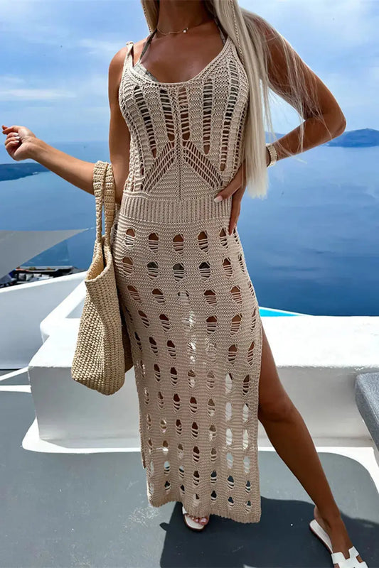 Full-length shot of a woman wearing a beige Openwork Slit Scoop Neck Sleeveless Cover Up over a black bikini.