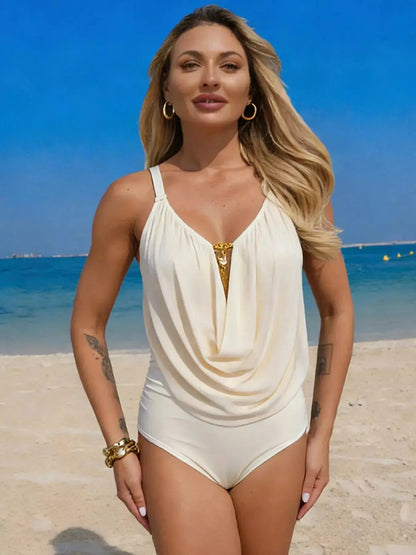 Front view of a solid color one-piece swimsuit featuring slimming ruched fabric and a supportive scoop neckline.